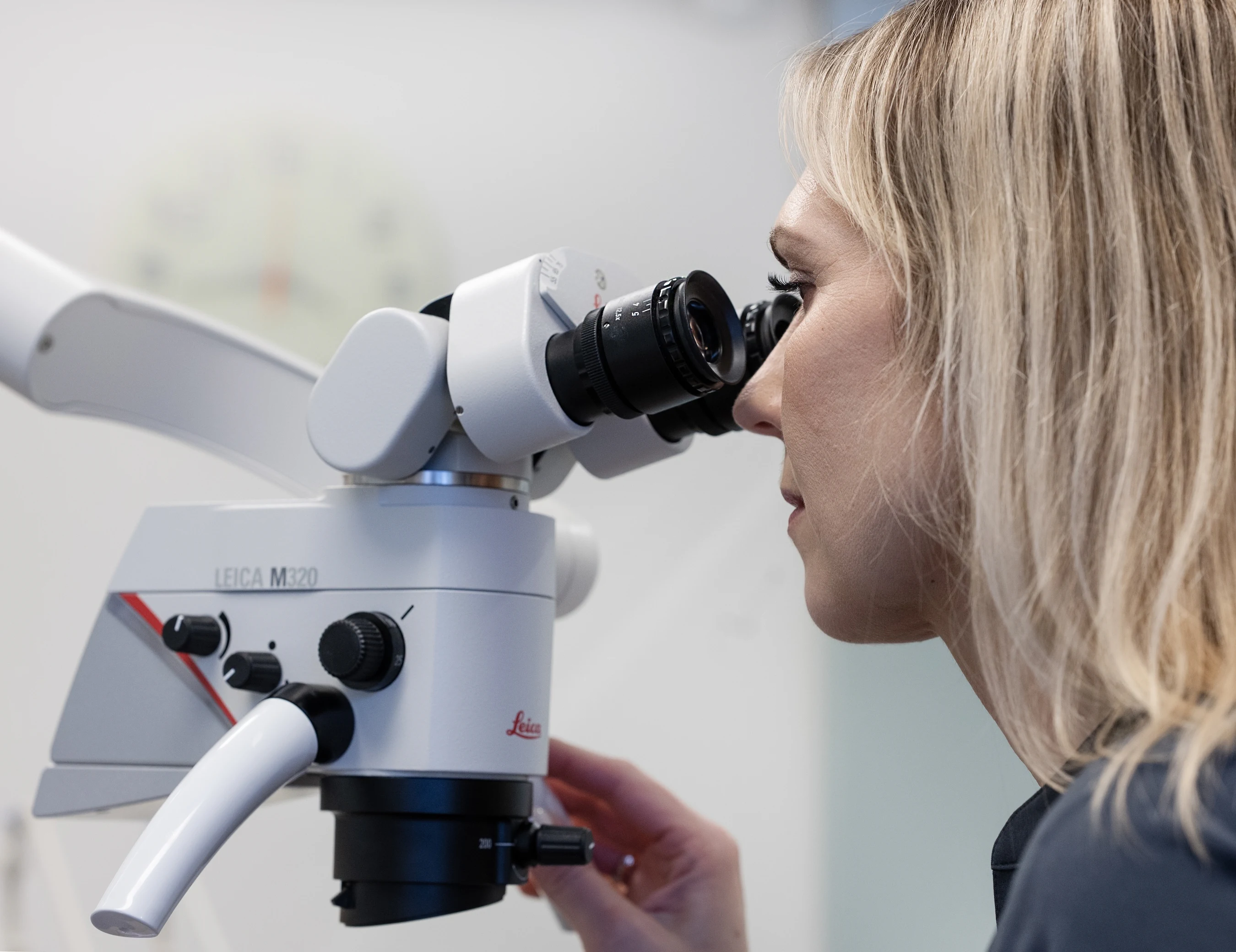Dentist working with a treatment microscope